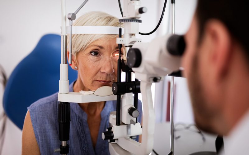 Ophthalmology concept. Senior woman eye vision examination in ophthalmological clinic